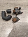 1988 Omc Cobra 2.3L Tko Thermostat Housing, Cylinder Head Elbow And Hoses. Fixed Price $150.00.